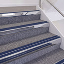 Mirrorflect Silver double insert chevron stair nosing, 60mm riser with Dark Blue inserts, fitted on carpeted stairs
