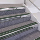 Mirrorflect Silver double insert chevron stair nosing, 60mm riser with Dark Green inserts, fitted on carpeted stairs