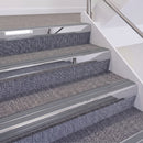 Mirrorflect Silver double insert chevron stair nosing, 60mm riser with Mid Grey inserts, fitted on carpeted stairs