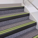 Satin Black double insert chevron stair nosing, 60mm riser with Apple Green inserts, fitted on carpeted stairs