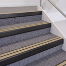 Satin Black double insert chevron stair nosing, 60mm riser with Beige inserts, fitted on carpeted stairs