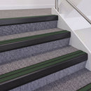 Satin Black double insert chevron stair nosing, 60mm riser with Dark Green inserts, fitted on carpeted stairs