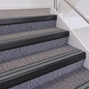 Satin Black double insert chevron stair nosing, 60mm riser with Mid Grey inserts, fitted on carpeted stairs