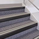 Satin Black double insert chevron stair nosing, 60mm riser with Oyster inserts, fitted on carpeted stairs