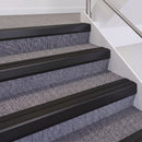 Satin Black double insert chevron stair nosing, 60mm riser with Premium Black inserts, fitted on carpeted stairs