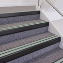 Satin Black double insert chevron stair nosing, 60mm riser with Sage Green inserts, fitted on carpeted stairs