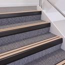 Satin Black double insert chevron stair nosing, 60mm riser with Sahara inserts, fitted on carpeted stairs