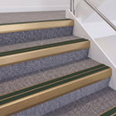 Satin Bronze double insert chevron stair nosing, 60mm riser with Dark Green inserts, fitted on carpeted stairs