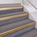 Satin Bronze double insert chevron stair nosing, 60mm riser with Mid Grey inserts, fitted on carpeted stairs