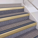 Satin Gold double insert chevron stair nosing, 60mm riser with Blue inserts, fitted on carpeted stairs