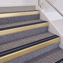 Satin Gold double insert chevron stair nosing, 60mm riser with Dark Blue inserts, fitted on carpeted stairs
