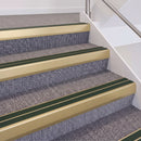 Satin Gold double insert chevron stair nosing, 60mm riser with Dark Green inserts, fitted on carpeted stairs