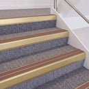 Satin Gold double insert chevron stair nosing, 60mm riser with Mid Brown inserts, fitted on carpeted stairs