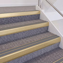 Satin Gold double insert chevron stair nosing, 60mm riser with Mid Grey inserts, fitted on carpeted stairs