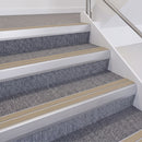 Satin Silver double insert chevron stair nosing, 60mm riser with Beige inserts, fitted on carpeted stairs