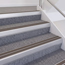 Satin Silver double insert chevron stair nosing, 60mm riser with Brown inserts, fitted on carpeted stairs