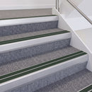 Satin Silver double insert chevron stair nosing, 60mm riser with Dark Green inserts, fitted on carpeted stairs