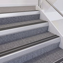 Satin Silver double insert chevron stair nosing, 60mm riser with Dark Grey inserts, fitted on carpeted stairs