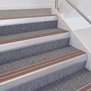 Satin Silver double insert chevron stair nosing, 60mm riser with Mid Brown inserts, fitted on carpeted stairs