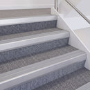 Satin Silver double insert chevron stair nosing, 60mm riser with Polar Grey inserts, fitted on carpeted stairs