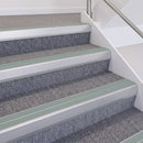 Satin Silver double insert chevron stair nosing, 60mm riser with Sage Green inserts, fitted on carpeted stairs