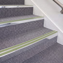 Bright Polished double insert chevron stair nosing, 70mm riser with Apple Green inserts, fitted on carpeted stairs