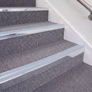 Bright Polished double insert chevron stair nosing, 70mm riser with Aura inserts, fitted on carpeted stairs
