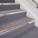 Bright Polished double insert chevron stair nosing, 70mm riser with Mid Brown inserts, fitted on carpeted stairs
