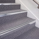 Bright Polished double insert chevron stair nosing, 70mm riser with Mid Grey inserts, fitted on carpeted stairs