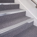 Bright Polished double insert chevron stair nosing, 70mm riser with Polar Grey inserts, fitted on carpeted stairs