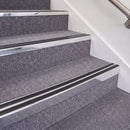 Bright Polished double insert chevron stair nosing, 70mm riser with Premium Black inserts, fitted on carpeted stairs
