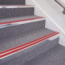 Bright Polished double insert chevron stair nosing, 70mm riser with Red inserts, fitted on carpeted stairs