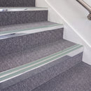 Bright Polished double insert chevron stair nosing, 70mm riser with Sage Green inserts, fitted on carpeted stairs