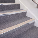 Bright Polished double insert chevron stair nosing, 70mm riser with Sahara inserts, fitted on carpeted stairs