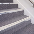 Bright Polished double insert chevron stair nosing, 70mm riser with White inserts, fitted on carpeted stairs