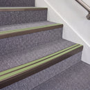 Dark Bronze double insert chevron stair nosing, 70mm riser with Apple Green inserts, fitted on carpeted stairs