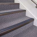 Dark Bronze double insert chevron stair nosing, 70mm riser with Blue inserts, fitted on carpeted stairs