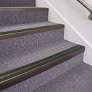 Dark Bronze double insert chevron stair nosing, 70mm riser with Dark Green inserts, fitted on carpeted stairs