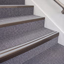 Dark Bronze double insert chevron stair nosing, 70mm riser with Polar Grey inserts, fitted on carpeted stairs