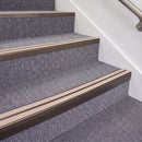 Dark Bronze double insert chevron stair nosing, 70mm riser with Sahara inserts, fitted on carpeted stairs