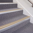Mill Finish double insert chevron stair nosing, 70mm riser with Beige inserts, fitted on carpeted stairs
