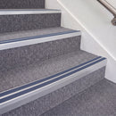 Mill Finish double insert chevron stair nosing, 70mm riser with Blue inserts, fitted on carpeted stairs