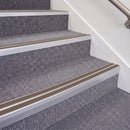 Mill Finish double insert chevron stair nosing, 70mm riser with Brown inserts, fitted on carpeted stairs
