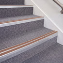 Mill Finish double insert chevron stair nosing, 70mm riser with Mid Brown inserts, fitted on carpeted stairs