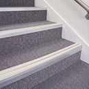 Mill Finish double insert chevron stair nosing, 70mm riser with White inserts, fitted on carpeted stairs