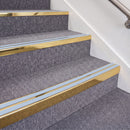 Mirrorflect Gold double insert chevron stair nosing, 70mm riser with Aura inserts, fitted on carpeted stairs
