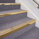 Mirrorflect Gold double insert chevron stair nosing, 70mm riser with Beige inserts, fitted on carpeted stairs