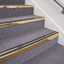 Mirrorflect Gold double insert chevron stair nosing, 70mm riser with Blue inserts, fitted on carpeted stairs