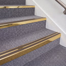 Mirrorflect Gold double insert chevron stair nosing, 70mm riser with Brown inserts, fitted on carpeted stairs