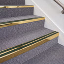Mirrorflect Gold double insert chevron stair nosing, 70mm riser with Dark Green inserts, fitted on carpeted stairs